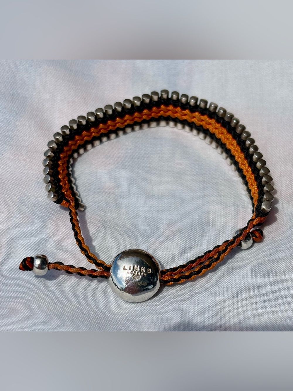Links of London orange and black